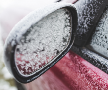 Frozen rearview mirror on car